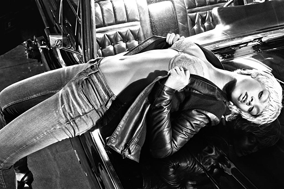 Rihanna in Armani Jeans and leather jacket